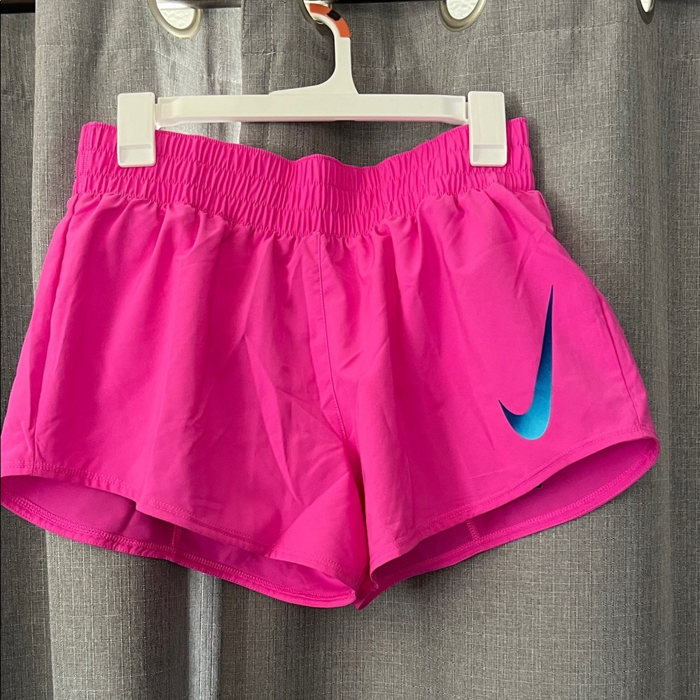 Nike Women's Pink Athletic Shorts with Blue Logo